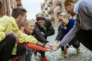 Group of friends joining hands